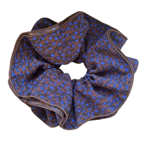 Retro brown and navy blue leopard print scrunchie hair tie with soft fabric texture