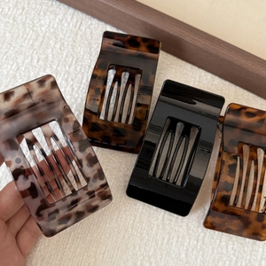 Set of four square claw clips in tortoiseshell and leopard patterns for women's hair