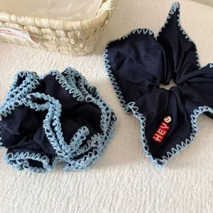 Navy blue scrunchie set with scalloped blue edges and red HEY heart embroidery