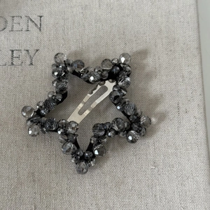 Exquisite handmade star-shaped beaded hair clip with faceted grey-black crystal beads