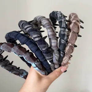 Detail of non-slip vintage plaid headbands with inner plastic teeth for secure grip