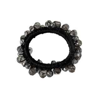 Elastic black hair tie featuring sparkling grey crystal beads in a minimalist style