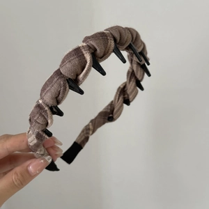 Detail of vintage brown plaid fabric headband featuring integrated small non-slip hair clips