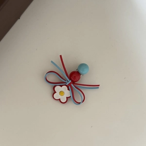 Handmade red and blue bow hair clip with daisy flower and beads decoration
