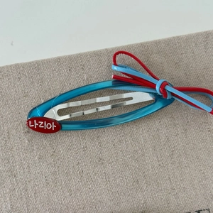 Blue translucent BB hair clip with red bow and heart accent in vintage Korean style