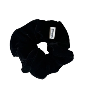 Black milk velvet scrunchie with handmade tag for minimalist hair styling fashion