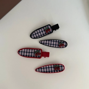 Set of 4 checkered hair clips with red cherry accents in duckbill and snap styles