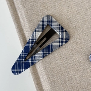 Blue and white plaid fabric triangle snap hair clip with a minimalist checkered pattern