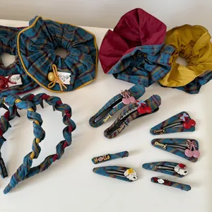Detailed collection of vintage red and blue plaid fabric bows and hair accessories