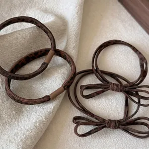Lot d'élastiques à cheveux imprimé léopard marron comprenant des modèles ronds et à nœuds