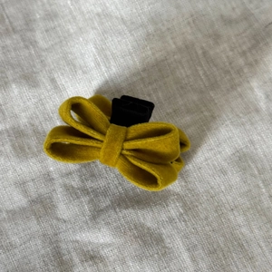 Ginger yellow velvet bow hair clip for women with multi-layered design and small claw grip