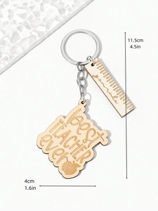 Detail of wooden Teacher gift keychain with engraved ruler and apple charm motifs