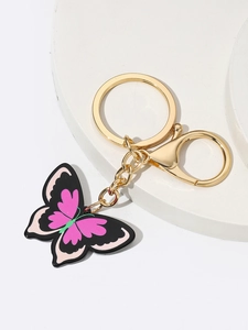 Detail of colorful acrylic butterfly pendant with gold-plated lobster clasp and ring
