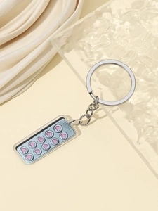 Portachiavi in acrilico con design realistico di blister di pillole blu e rosa