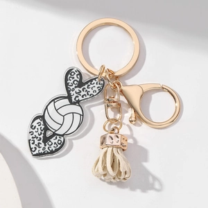Detail of volleyball leopard heart keychain with lobster clasp and cream tassel