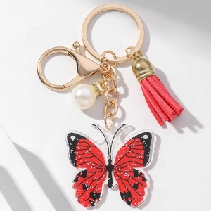 Acrylic butterfly keychain with red black glitter, pearl and tassel on gold ring