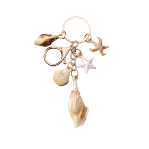 Marine themed keychain with seashell, starfish and conch charms on a gold ring