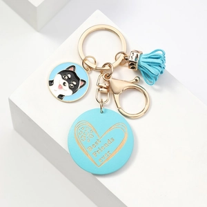 Detail of blue Best Friends ever keychain with Shiba Inu charm and gold lobster clasp