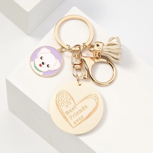 Creative Best Friends ever keychain with purple puppy charm, cream tassel and gold heart pendant