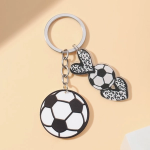 Detailed close-up of acrylic soccer ball keychain with trendy leopard heart pendants