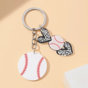 Macro view of baseball themed LOVE key ring with leopard print heart and sports charms