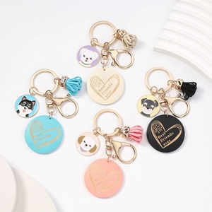 Detail of dog themed keychains with leather tassels and Best Friends ever heart charms