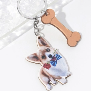 3D Corgi keychain with red rose and bone charm on a minimalist white background