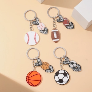 Close-up of leopard heart sports keychains with baseball basketball soccer football