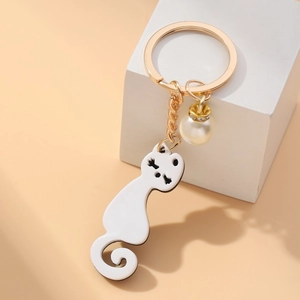 Cute white acrylic cat keychain with elegant pearl and golden metal ring hardware