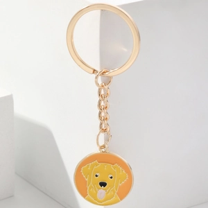 Golden metal keychain with a colorful Golden Retriever pendant on a white background