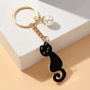 Cute black acrylic cat keychain with white faux pearl and golden alloy ring for women