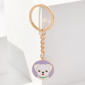 Cute white cartoon puppy on purple enamel gold metal keychain with modern studio backdrop