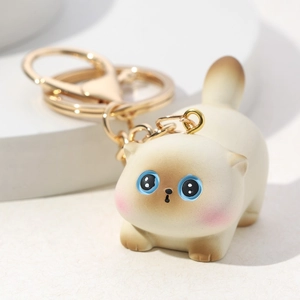 Cute 3D cartoon resin cat keychain with blue eyes and gold metal lobster clasp