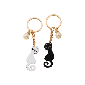 Cute black and white kitten acrylic keychains with pearls and gold metal rings