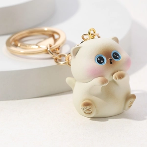 3D cute cartoon resin cat keychain with gold ring on minimalist geometric background