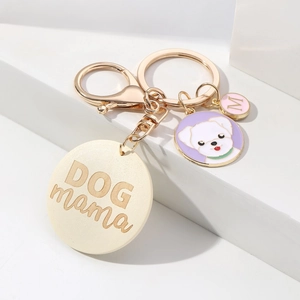 Close-up of DOG mama wooden tag with purple enamel husky dog charm and golden clasp