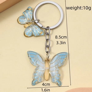 Detail showing resin butterfly keychain dimensions of 8.5cm length and 4cm width
