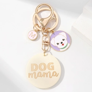 Dog Mama keychain with tassel, golden lobster clasp, and cute puppy charm for pet lovers