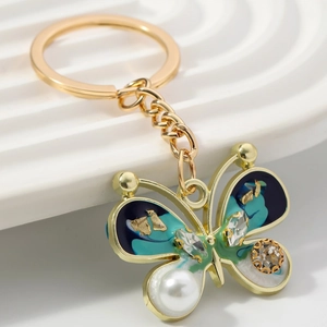 Exquisite gold butterfly keychain with blue-green enamel, pearls and crystals decor