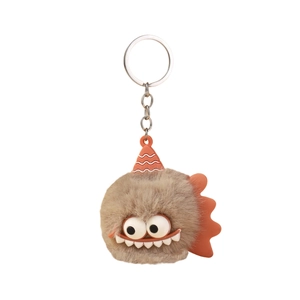 Cute brown plush monster keychain with large eyes and orange striped hat on white background