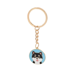 Cute black and white Shiba Inu enamel metal keychain with gold plated chain on white background