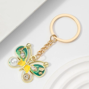Exquisite gold butterfly keychain with colorful enamel, faux pearls and sparkling crystals