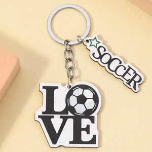 Wooden soccer love keychain featuring sports themed engraving on light background
