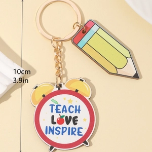 Detail view of wooden teacher appreciation keychain with pencil and clock charms