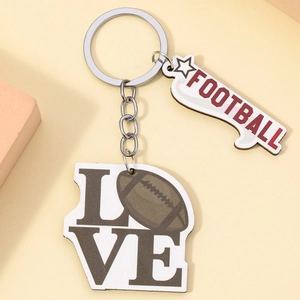 Detail of football keychain featuring acrylic LOVE and FOOTBALL lettering with ball design