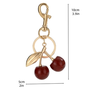 Detailed view of the red cherry keychain with 10cm height and 5cm width dimensions