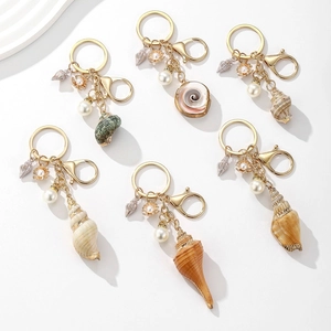 Nautical seashell and pearl keychains set with gold rings for beach vacation style accessories