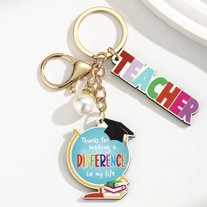 Close-up of wood teacher keychain with globe pendant and faux pearl on white background