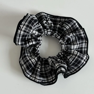 Chic black and white checkered oversized scrunchie for elegant bun hairstyles