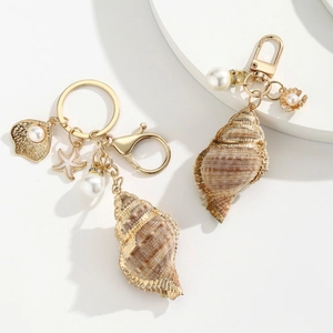Elegant gold-edged shell and pearl keychain with starfish pendant for phone or bag